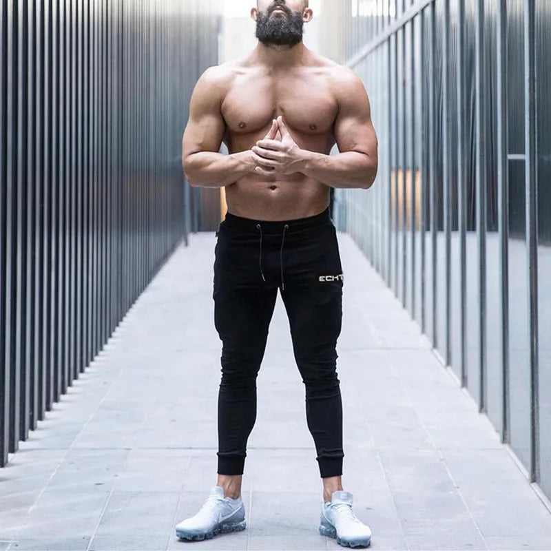 Pantalones de chándal ajustados de gimnasio para hombres, para correr, fitness, culturismo, bolsillo con cremallera, algodón