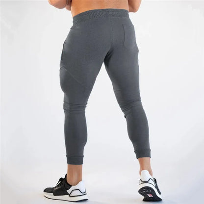 Pantalones de chándal ajustados de gimnasio para hombres, para correr, fitness, culturismo, bolsillo con cremallera, algodón